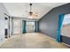 Bedroom featuring carpeted floors and a sliding barn door accent at 10866 S Dreamy Dr, Goodyear, AZ 85338