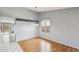 Dining area with hardwood floors, large window, and access to the backyard through sliding glass doors at 10866 S Dreamy Dr, Goodyear, AZ 85338