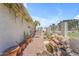 Backyard patio featuring a rock water feature, outdoor seating, and a privacy fence at 11465 N 56Th St, Scottsdale, AZ 85254