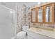 Bathroom featuring patterned wallpaper, a shower, a toilet, and a vanity with a mirror at 11465 N 56Th St, Scottsdale, AZ 85254