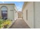 Exterior walkway view with brick-paved entrance leading to a double-door entrance at 11465 N 56Th St, Scottsdale, AZ 85254