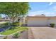 Charming home featuring a well-kept front yard with mature tree and red-tiled roof at 11465 N 56Th St, Scottsdale, AZ 85254