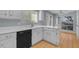 Well-lit kitchen featuring white cabinets and countertops, and stainless steel appliances at 11465 N 56Th St, Scottsdale, AZ 85254