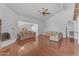 Spacious living room with hardwood floors, fireplace, and natural light at 11465 N 56Th St, Scottsdale, AZ 85254