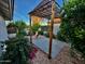 Relaxing backyard seating area with stone flooring and outdoor fireplace at 12221 S Paiute St, Phoenix, AZ 85044