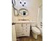 This bathroom features a white vanity with a light countertop and bronze hardware and a shower/tub combo at 12221 S Paiute St, Phoenix, AZ 85044
