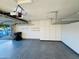 Spacious garage with storage cabinets and epoxy flooring at 12221 S Paiute St, Phoenix, AZ 85044