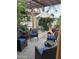 Cozy patio setting features comfortable seating, an umbrella, and a charming pergola at 12221 S Paiute St, Phoenix, AZ 85044