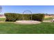 Outdoor ceremony space on manicured lawn surrounded by shrubbery at 12353 W Running Deer Trl, Peoria, AZ 85383