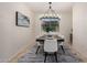 Elegant dining room featuring modern chandelier, seating for six, and stylish decor at 12353 W Running Deer Trl, Peoria, AZ 85383