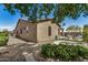 Exterior view of the home showcasing the backyard, gravel, and desert landscaping at 12353 W Running Deer Trl, Peoria, AZ 85383