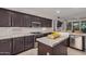 Modern kitchen showcasing granite countertops, stainless steel appliances, and custom cabinetry at 12353 W Running Deer Trl, Peoria, AZ 85383