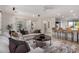 Spacious living room boasting neutral decor, stylish furnishings, and seamless access to the kitchen at 12353 W Running Deer Trl, Peoria, AZ 85383