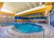 Bright indoor pool with swimming lanes and a spa at 12353 W Running Deer Trl, Peoria, AZ 85383