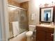 Modern bathroom featuring tiled shower with glass doors, updated vanity, and tiled flooring at 14636 N Yerba Buena Way # B, Fountain Hills, AZ 85268