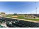Ballpark seating view overlooking home plate with blue skies, jumbotron, and signage at 1505 N Center St # 220, Mesa, AZ 85201