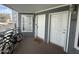 Front porch view with two doors and bicycles parked; a welcoming entrance to the unit at 1505 N Center St # 220, Mesa, AZ 85201
