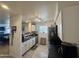 Modern kitchen with granite countertops, stainless steel appliances, and bright white cabinetry at 1505 N Center St # 220, Mesa, AZ 85201