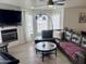 Cozy living room featuring a fireplace, large windows, comfortable seating, and modern decor at 1505 N Center St # 220, Mesa, AZ 85201