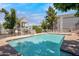 Community pool surrounded by mature trees, lounge chairs, and a gazebo with ample seating at 1505 N Center St # 220, Mesa, AZ 85201