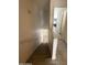Inviting staircase leading to the upper level, complemented by wood-look flooring and natural light at 1505 N Center St # 220, Mesa, AZ 85201
