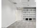 Finished basement boasts built-in shelving and cabinets, providing ample storage and display space at 15243 N 52Nd Dr, Glendale, AZ 85306