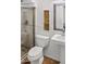 Bathroom featuring a shower with glass door, white toilet, and an ornate mirror above a pedestal sink at 15243 N 52Nd Dr, Glendale, AZ 85306