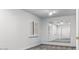 Bright bedroom with large mirror, a window with shutters, and a ceiling fan providing a spacious and airy feel at 15243 N 52Nd Dr, Glendale, AZ 85306