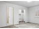 Bedroom featuring carpet, shutters, closet, and entry doors provides a versatile and comfortable living space at 15243 N 52Nd Dr, Glendale, AZ 85306