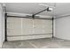 A spacious two car garage with an automatic overhead door at 15243 N 52Nd Dr, Glendale, AZ 85306