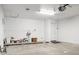 A two car garage with a washing machine, utility sink, and overhead lights at 15243 N 52Nd Dr, Glendale, AZ 85306
