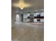 Modern kitchen with stainless steel appliances, white cabinets, and tile flooring at 15243 N 52Nd Dr, Glendale, AZ 85306