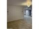 Spacious living room featuring decorative trim, recessed lighting, and tile floors at 15243 N 52Nd Dr, Glendale, AZ 85306