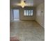 Bright living room featuring decorative trim, recessed lighting, tile floors and a large window at 15243 N 52Nd Dr, Glendale, AZ 85306