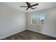 Cozy bedroom filled with natural light from the window; offers modern flooring and ceiling fan at 15346 W Hearn Rd, Surprise, AZ 85379