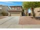 Two-story home with a tile roof, two car garage and low maintenance landscaping at 15346 W Hearn Rd, Surprise, AZ 85379