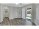 Bright living room with sliding door access to outdoor space with modern flooring at 15346 W Hearn Rd, Surprise, AZ 85379