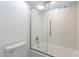 Modern bathroom showcasing tile shower with glass door and a low flow toilet at 1637 E Camino Del Santo --, Phoenix, AZ 85022