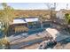 Stylish home featuring desert landscaping, a gray exterior, and a rooftop deck above the garage, perfect for entertaining at 1637 E Camino Del Santo --, Phoenix, AZ 85022