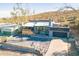 Stylish home featuring desert landscaping, a gray exterior, and a rooftop deck above the garage, inviting you to unwind at 1637 E Camino Del Santo --, Phoenix, AZ 85022