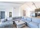 Spacious living room featuring an expansive sectional sofa, modern decor, and an open floor plan at 1637 E Camino Del Santo --, Phoenix, AZ 85022