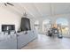 Bright living room showcasing modern arched windows, a cozy fireplace, and an open-concept design at 1637 E Camino Del Santo --, Phoenix, AZ 85022