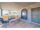 Covered patio features comfortable seating, arched windows and doorway, and mountain views at 1637 E Camino Del Santo --, Phoenix, AZ 85022