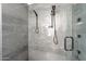 Detailed view of a modern shower with gray tile and multiple showerheads at 1637 E Camino Del Santo --, Phoenix, AZ 85022