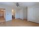 Spacious bedroom with a ceiling fan, and ensuite bathroom at 168 S 223Rd Dr, Buckeye, AZ 85326