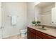 Cozy bathroom featuring tile flooring, wood vanity, framed mirror, and a combined shower and tub at 20121 N 76Th St # 2064, Scottsdale, AZ 85255