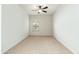 Bright bedroom featuring neutral carpet, a ceiling fan, and a window providing natural light at 20121 N 76Th St # 2064, Scottsdale, AZ 85255
