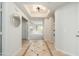 Bright entryway featuring decorative tiled floors, a modern light fixture, and neutral wall paint at 20121 N 76Th St # 2064, Scottsdale, AZ 85255
