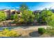 Exterior view of the property showing a shared fence, landscaping, and building exteriors at 20121 N 76Th St # 2064, Scottsdale, AZ 85255