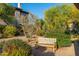 Community grounds feature a bench surrounded by lush desert landscaping at 20121 N 76Th St # 2064, Scottsdale, AZ 85255